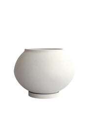 101 CPH Sunao Planter - Fat in matte off-white ceramic, featuring a rounded, bulbous form with a classic opening and a flat base, displayed on a clean white background. A statement ceramic planter.