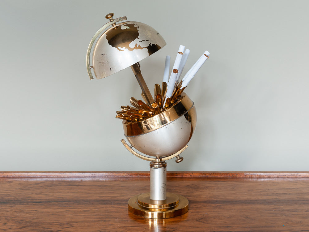 VINTAGE ANGLED WORLD GLOBE GOLD CIGARETTE HOLDER DISPENSER