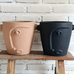 Pottery With Carved Faces