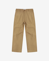 Full-length front view of Uskees twill workwear pants in khaki. Showing Corozo button fastening and tapered leg fit.