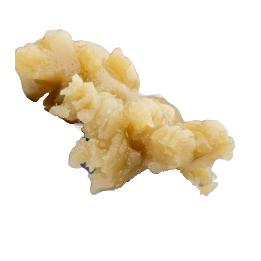 A close-up of a metal utensil holding a scoop of beige, creamy, and slightly lumpy GMO THCa Hash Rosin by roz from frasier against a white background.