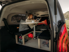 Van seating area with pop-up table installed