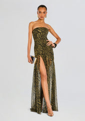 Model in Nicole Silk Chiffon Dress olive and black zebra print with sheer overlay and high slit.