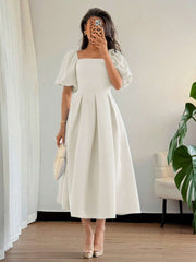 Step into charm with this Elegant Minimalist Puff Sleeve Dress, perfect for your office hours or casual adventures. Featuring a stylish pleated hem and a flattering square neck, it blends comfort and flair effortlessly. The puff sleeves add a fun twist, making every move feel light and playful. Whether you're at a meeting or out with friends, this dress keeps your look fresh and effortlessly chic.