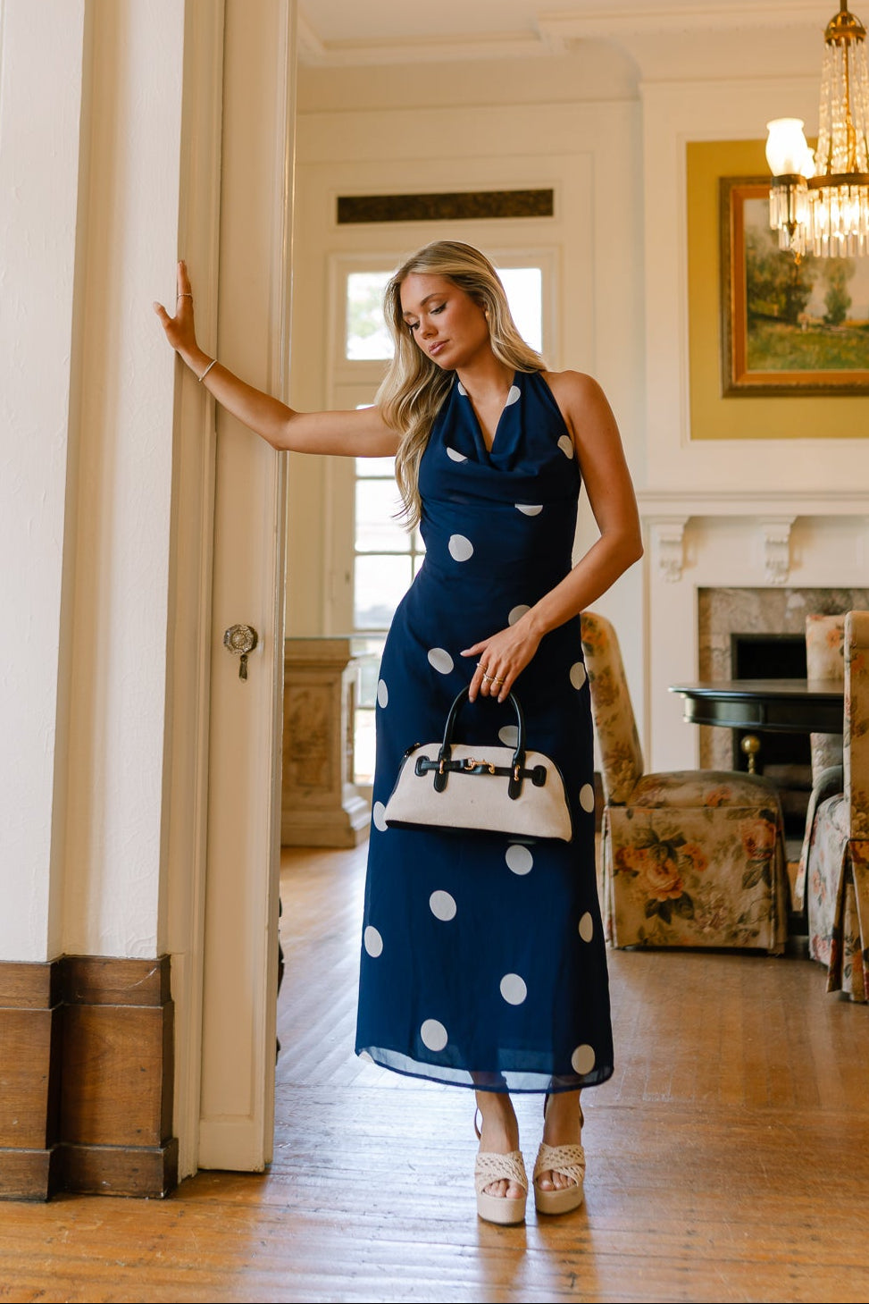front view of the Roma Blue And White Polka Dot Halter Maxi Dress