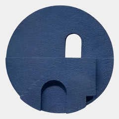 Arcuza Blue III Wood Carving Sandstone 3D Wall Art by Giant Sculptures, a circular indigo-blue textured piece with carved arch, window cutout, and layered planes on a light background.
