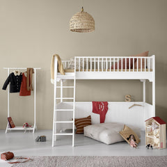 White Oliver Furniture Seaside Classic Loft Bed with convertible design, ladder access, and open space below for customizable storage and play areas in modern children's bedroom.