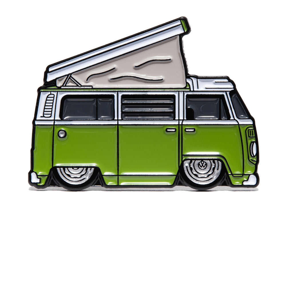 Metal enamel pin of a lowered T2 Volkswagen camper van in white and green with silver wheels. Van has a lifted rooftop tent.