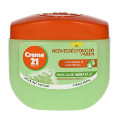 Green jar of Creme 21 Vaseline with orange lid on a white background