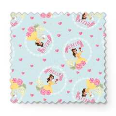 Princess Belle pattern with yellow dress, "Belle" text, hearts, and flowers on light blue background fabric swatch mockup