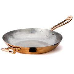 Hand-hammered to perfection by our expert coppersmiths, the 12.5” Fry Pan is a chic cooking staple. Its gleaming copper exterior is complemented by a double layer of tin interior lining. Applied by hand by our artisans, each layer gives the inside of the pan an even protective coat that guarantees a lasting cookware piece.