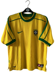 Maillot foot vintage domicile jaune du brésil 1998. On peut retrouver l'équipementier Nike. Ils s'agit d'un maillot authentique d'époque.