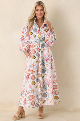 Maxi dress with collared neckline, full button-front closure, removable waist belt, and voluminous long sleeves with elastic cuffs.
