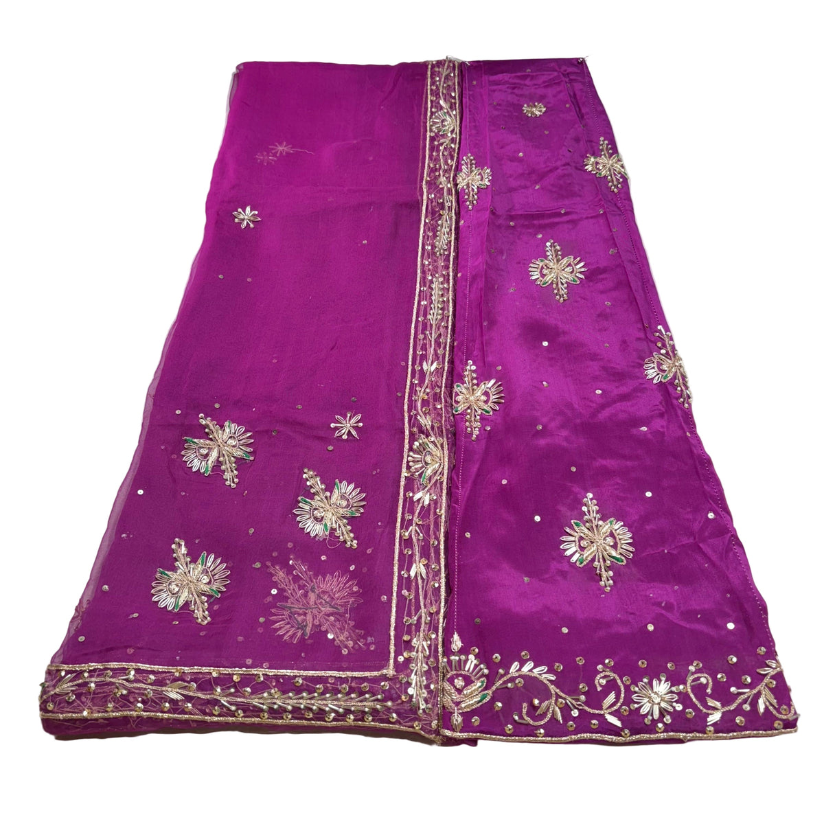 Purple saree with gold embroidery on a white background