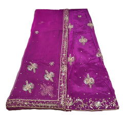 Purple saree with gold embroidery on a white background