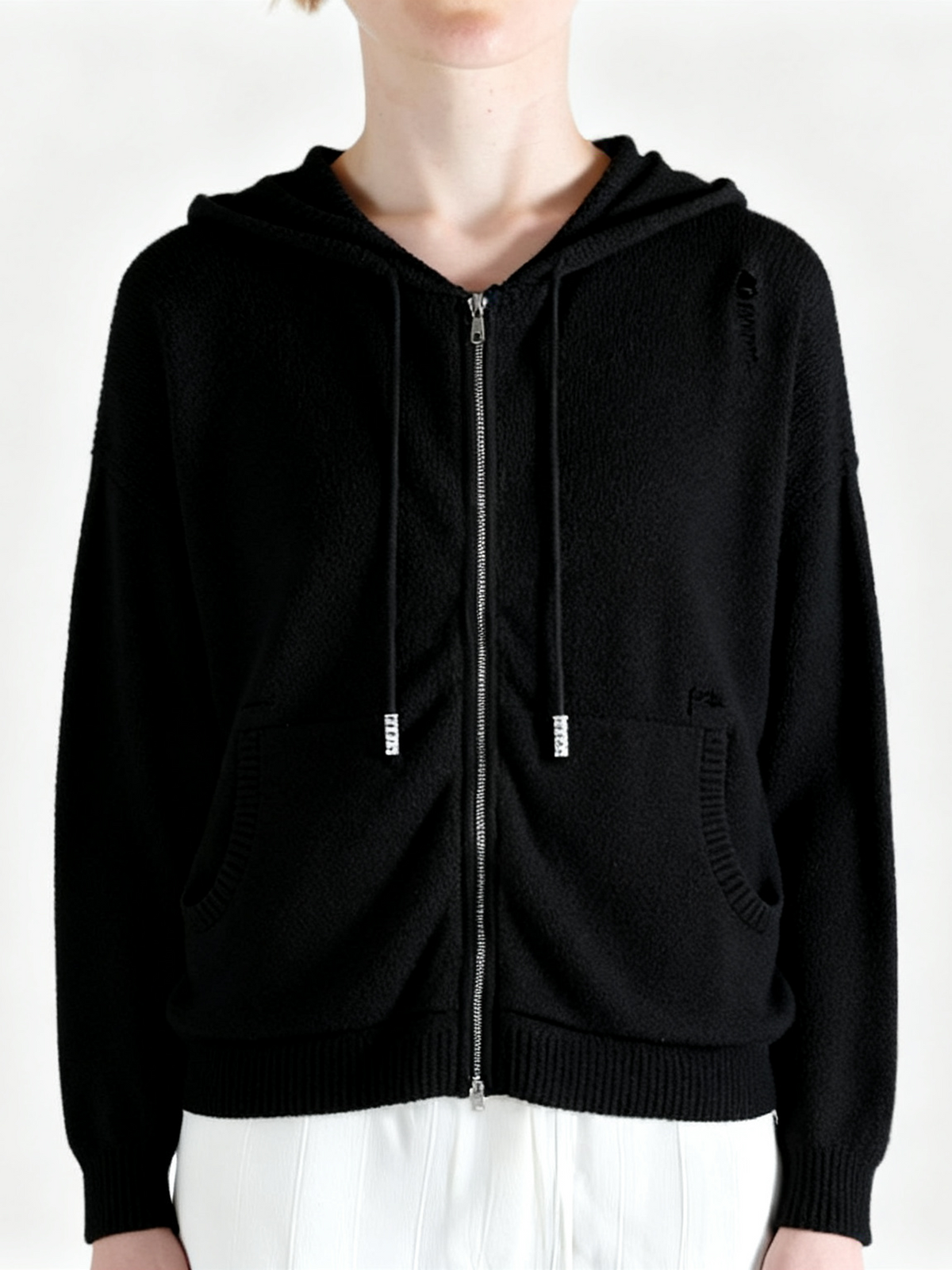 Black hoodie worn by a person, showing the hoodie fit
