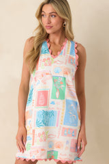 Cropped view of the neckline showing the pink scallop ric rac trim framing the v-shape