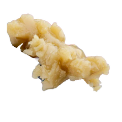 A close-up of a metal utensil holding a scoop of beige, creamy, and slightly lumpy GMO THCa Hash Rosin by roz from frasier against a white background.