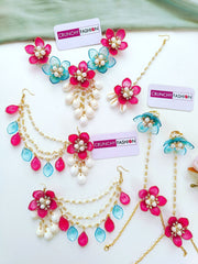 Sky-blue and pink floral resin jewellery set with gold plating, ideal for haldi or mehndi ceremonies for brides