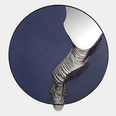 Rivelune Navy Blue Sculptural Round Mirror 3D Wall Art featuring a deep navy leather base, mirrored crescent, and cascading hand-finished metallic ripple detail, shown on a light background.
