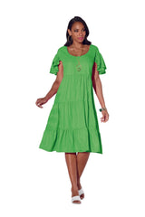 Model wearing Studio EY Hot Pink plus size church dresses with a tiered hem.