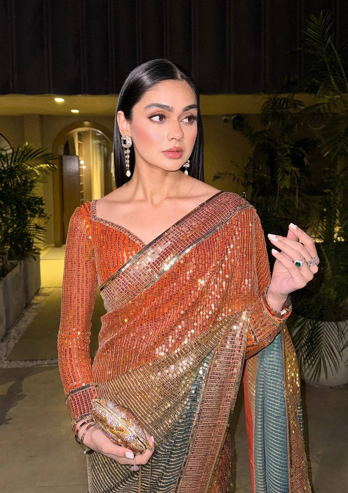 Elegant chiffon saree with printed and embroidered fall and pallu, paired with an embroidered chiffon blouse featuring organza neckline, borders, and a silk petticoat.