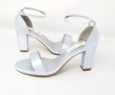 A pair of baby blue block heel shoes with an ankle strap