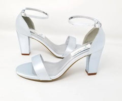 A pair of baby blue block heel shoes with an ankle strap