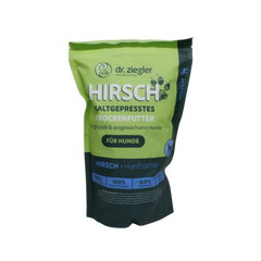 Grün-schwarze Verpackung von dr. ziegler Naturfutter mit der Aufschrift 'HIRSCH KALTGEPRESSTES TROCKENFUTTER für Hunde' und Zusatz 'HIRSCH + Hanfblätter'.