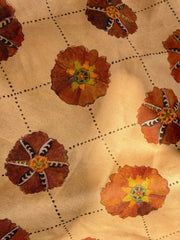 A piece of suzani fabric with floral patterns in beige, brown, and multicolor hues,  available  to buy on the-salon.com. SALON curates the finest , unique, handmade pieces from the interior industry's best makers and brands. Shop luxury furniture, lighting, rugs, art, antiques and vintage pieces and accessories from SALON interior designed rooms.
