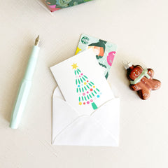 modern christmas tree with rainbow lights, merry christmas greeting, folded enclosure cards, mini greeting cards, gift card enclosure