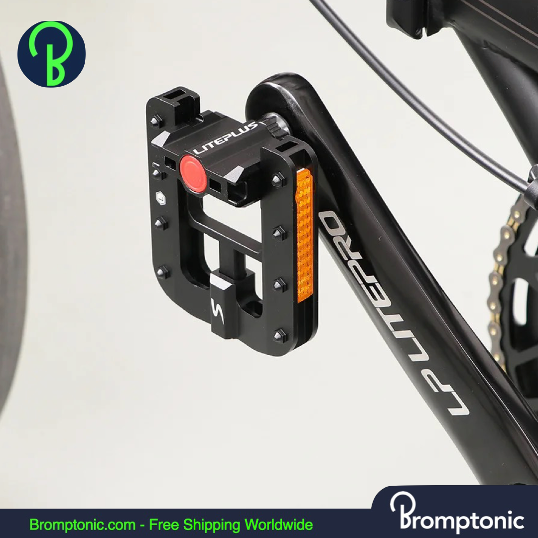 Brompton Liteplus pedal with orange reflector, mounted on black frame