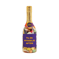 Champagneflaske med slik og etiketten "Til en hyggelig aften" – fyldt med Favorit Mix fra SlikEkspressen.